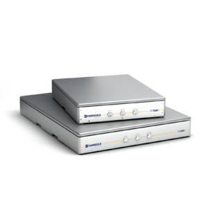Two silver ISOTablA vibration isolators stacked on top of eachother with the Fabreeka logo.